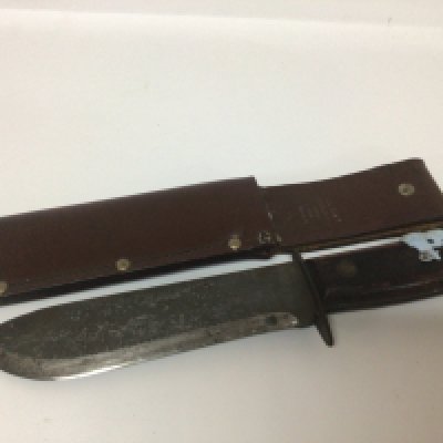 A British Military knife with leather scabbed both knife and scabbard with military marks and makers marks FE Hopkinson Ltd JR 1979 127/8214 length 34cm