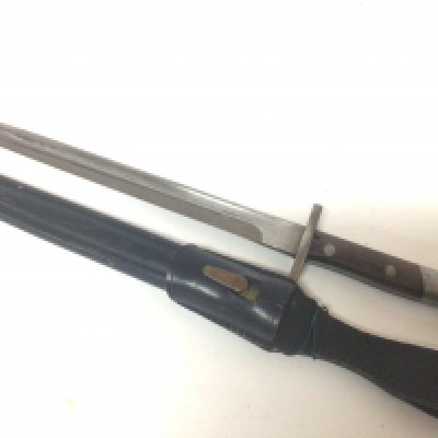 A K98 type bayonet unmarked with a hook quillion stamped 2961 1 leather and brass scabbard leather frog and in very good condition.