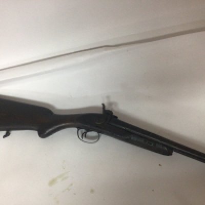 An Antique muzzle load hammer percussion double barrel shot gun. Non functional and for wall ornamentation.