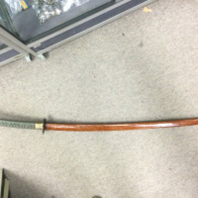 A Korean katana with later alterations. Blade length 91cm. Comes with outer fabric cover. Shipping category D.