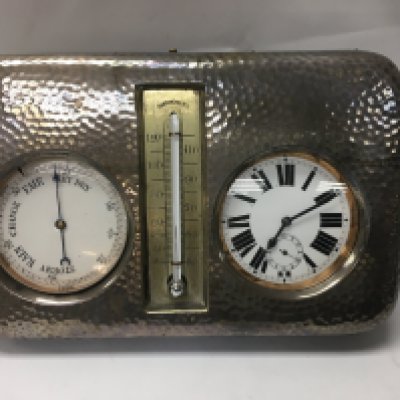 Navel interest, a desk clock and barometer fitted in a Silver case Provenance, originally owned by captain Rory Chambers O' Conor of H.M. S Hood .