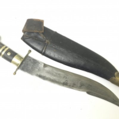 An Antique Indian dagger with an inlaid horn handle and leather and brass scabbard. length 40cm