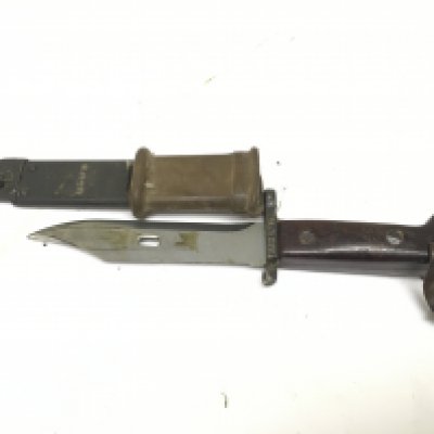 An early example Military AK67 bayonet with Bowie type blade with saw edge stamped AEG 0718.