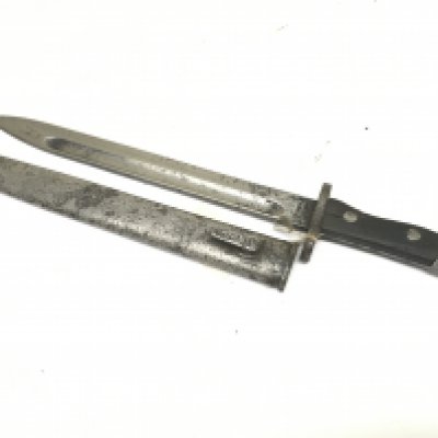 A German K98 German bayonet with wooden grip with unusual marks to the blade.