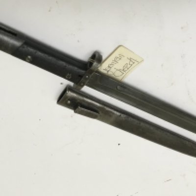 A II world war bayonet the M95 pattern Czechoslovakia bayonet with steel scabbard makers marks to the blade CSZ the bayonet also numbered B 7027.