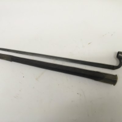 A 19th century Spike socket bayonet with leather and brass scabbard the socket with numbers.