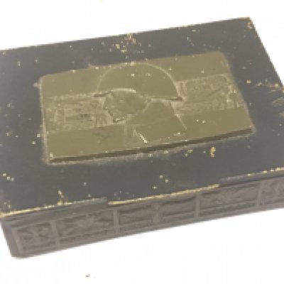 An unusual Russian Military cigarette box the rectangular top with a raised plaque the underside of the lid with Russian inscription.12.5x9cm