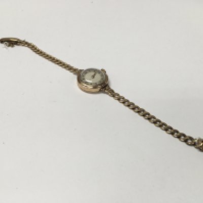 A 9ct gold ladies watch with a 9ct gold watch strap. 16.43 grams