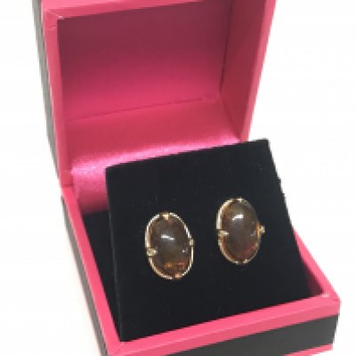 A pair of 9 carat gold and amber earrings. 2.1g in total. Postage category A