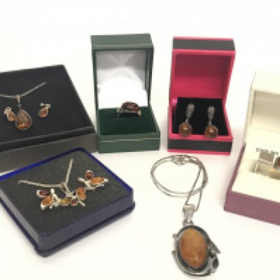 A Collection of silver and amber jewellery including necklaces, rings and earrings. Postage category B