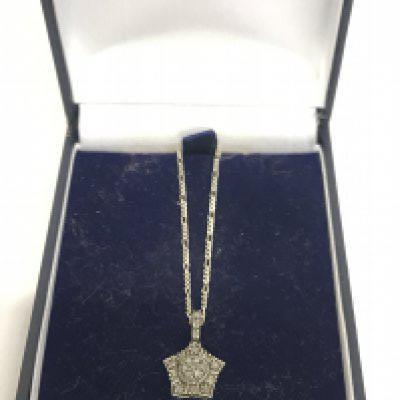 A silver star pendant on chain, postage category A