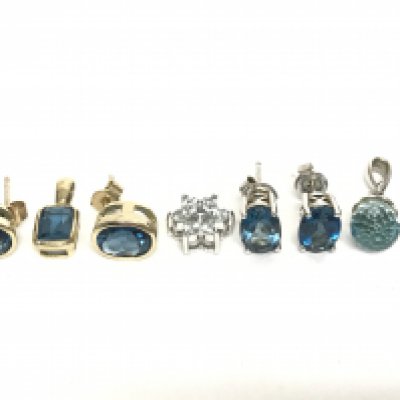 A 14ct white gold pendant, a pair of 9ct yellow gold earrings set with blue citrine stones, a 9ct yellow gold pendant set with a blue citrine stone and silver earrings/ pendants. Total gold weight 5g approximately. Postage category A