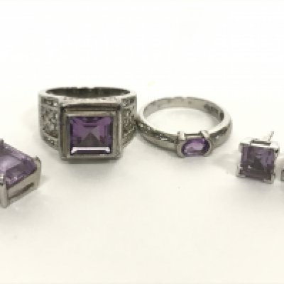 A 14 carat white gold amethyst set pendant, a pair of 9 carat white gold amethyst set earrings and silver amethyst set rings. Total gold weight 4.3g Postage category A