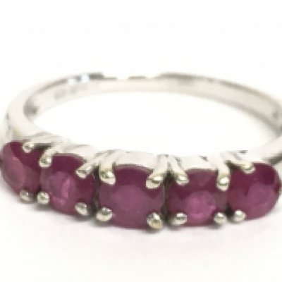 A 9 carat white gold ruby set ring, size N/O. 2.3g Postage category A