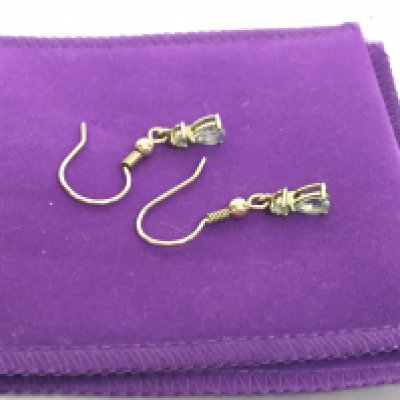 A pair of Aquamarine 9 carat yellow gold earrings, with certificate. Postage category A