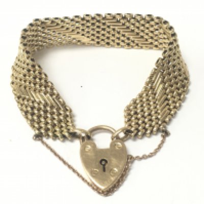 An 18ct gold mesh bracelet with heart padlock. 35.64g