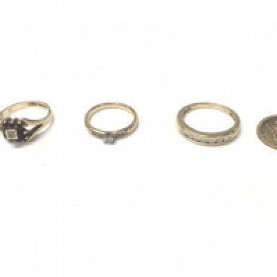 Three 9ct gold rings set with assorted stones and a 9ct st Christopher. Total weight 10.7g. Two rings size L and one S