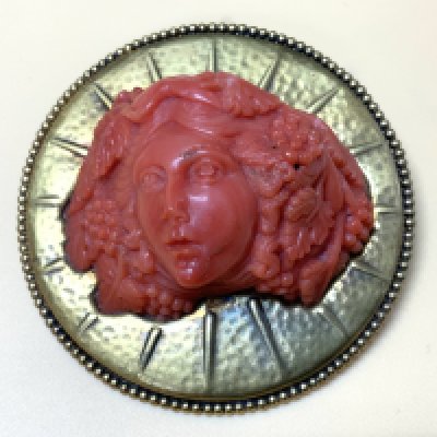 A 14k gold brooch inset with a. carved coral bust depicting the maiden Hyetta and Shabriri Grapes (the mysterious blind woman) circa 1840-80, engraved to the reverse with a personalised message in Russian Cyrillic. 6cm Diameter x Depth 2.5cm, total weight 64.52g (possibly altered more recently) A.