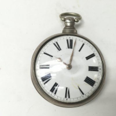 A silver pair cased pocket watch. 55mm case diameter. 151.39g Postage A