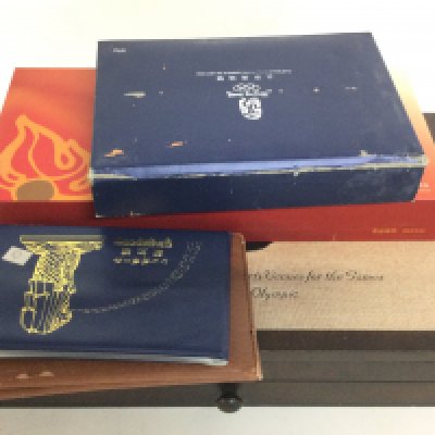 A collection of Beijing Olympics commemorative coins and a boxed silver bar. Postage catC