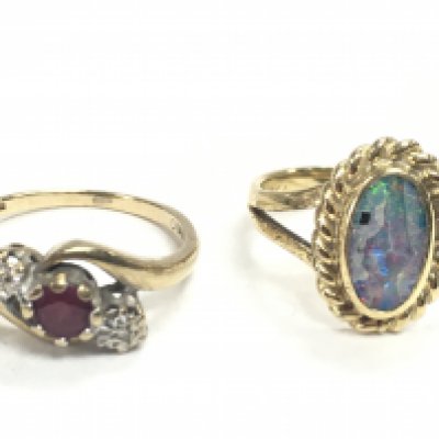 Ladies rings including an 18 carat gold ring set with an opal stone (3.6g ) & a 9 carat gold ring set with a ruby and diamond shards (2g). Postage category A