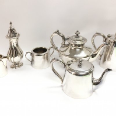 A silver plated tea service and a hallmarked silver sugar sifter. Postage category C