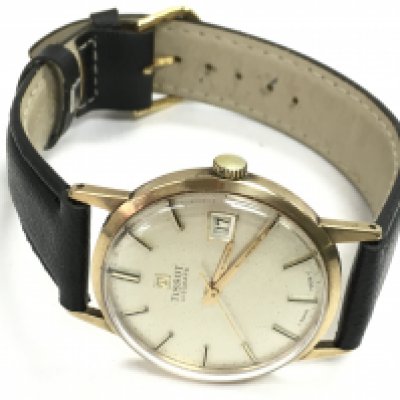 A Tissot Visodate 9 carat gold circa 1960s manual wind wristwatch with a black strap. Approximately 30g overall weight . Seen working This lot cannot be posted