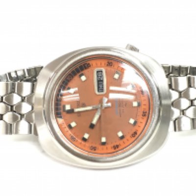 Seiko 5 sports day/ date 1970s Gents wristwatch with a burnt orange dial and revolving outer bezel. This lot cannot be posted