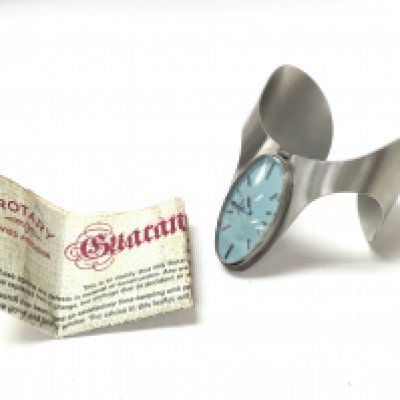 An unusual ladies rotary watch with its original guarantee certificate.