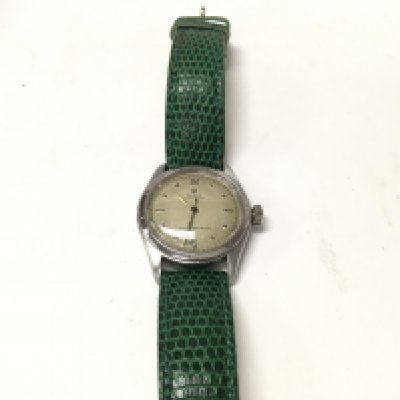A steel 1950s-1960s gents Rolex on a leather strap.