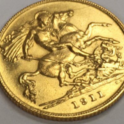 A 1911 gold half Sovereign. Postage category a