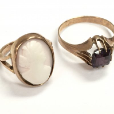 9 carat unmarked rose gold rings, one set with a small cameo and the other a dark purple amethyst stone. Sizes K & S. 8.8g total weight Postage category A
