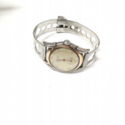 A vintage eterna automatic watch with a gold bezel.