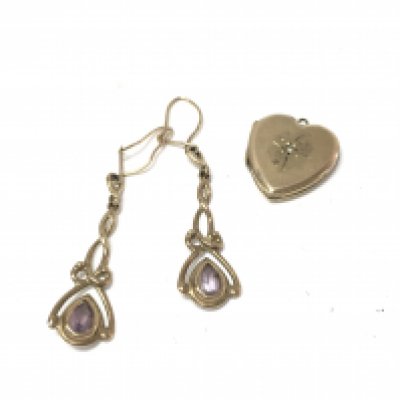 A 9ct gold locket set with chip diamond and a pair of unmarked earrings. Approx 5.1grams.