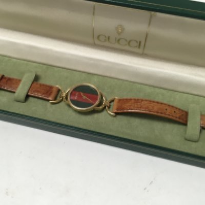 A Boxed ladies Gucci watch.
