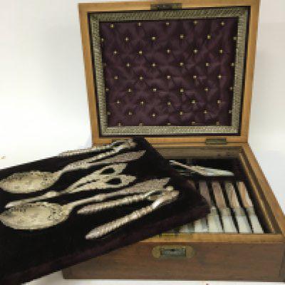 A Quality cased Edwardian silver plated and mother of pearl handled nut and fruit set twelve knifes and folks serving implements in a well fitted interior.