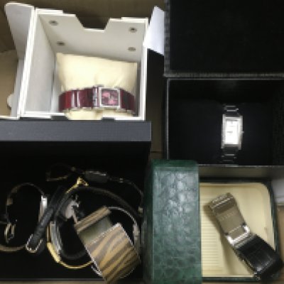 A box of watches some unworn and boxed.