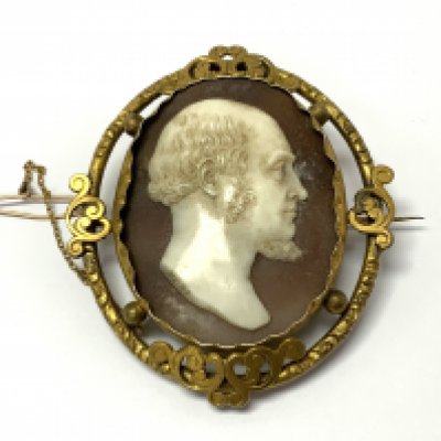 Neri Brothers, A gilt metal mounted shell fine carved cameo brooch, circa 1825. Oval, carved to depict a bearded gentleman, signed 'Neri. 7.2cm x 6.3cm (A)