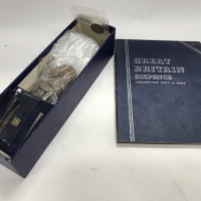 A collection of used world coinage in a box and album. NO RESERVE