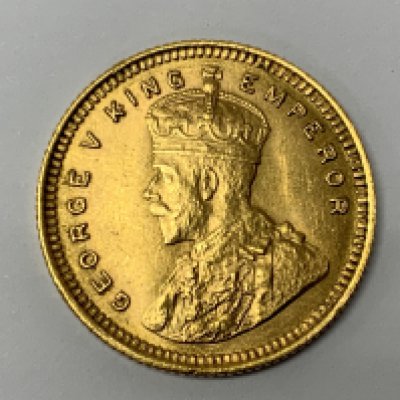 1918 15 Rupees Crowned bust of King George V, facing left. Surrounded by legend, all within a raised toothed border. EF +