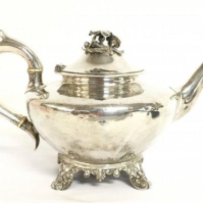 A William IV hallmarked silver tea pot, 16.5cm tall. Postage category C