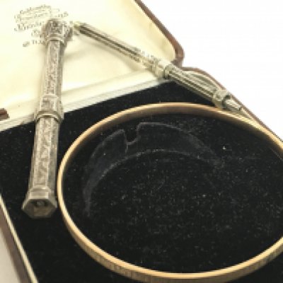 A metalcore 9ct gold bangle and two silver pens. Postage category A