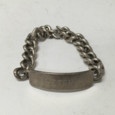 A silver Id bracelet.