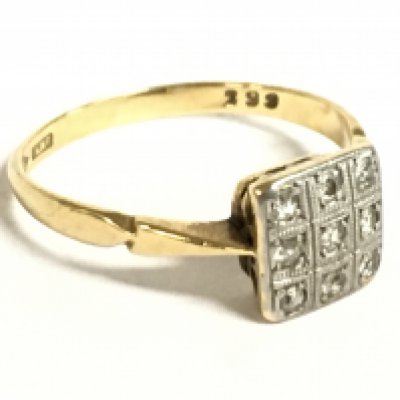 An Art Deco 18 carat gold and platinum diamond panel ring, 2.5g, size O. Postage category a