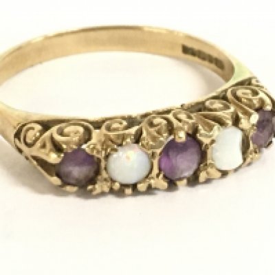 A 9 carat gold opal and amethyst, 2.3g. Size O Postage category A