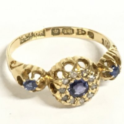 An 18ct gold sapphire and diamond three panel ring, 2.1g. Size J. Postage category A