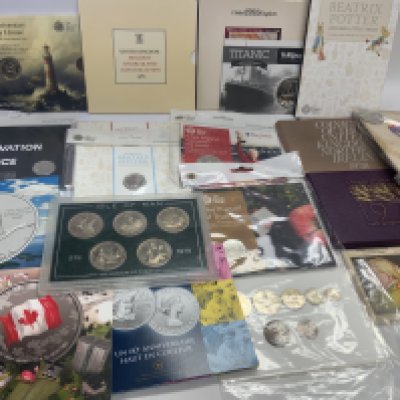 A collection of proof coin sets, uncirculated sets, Canadian commemorative fine silver presentation coins. Etc.
