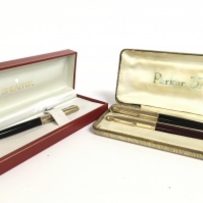 A boxed Parker 51 set and boxed Sheaffer white dot. Postage category B