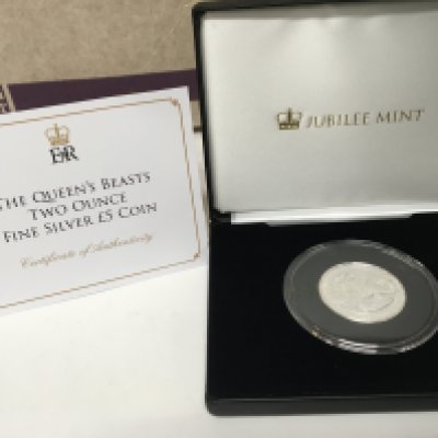 A Silver Two Ounce coin The Querns Beast Red Dragon of Wales 2017. With certificate of Authenticity the coin in a sealed Perspex case and fitted box