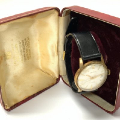 9ct gold Garrard wristwatch. Postage category A.